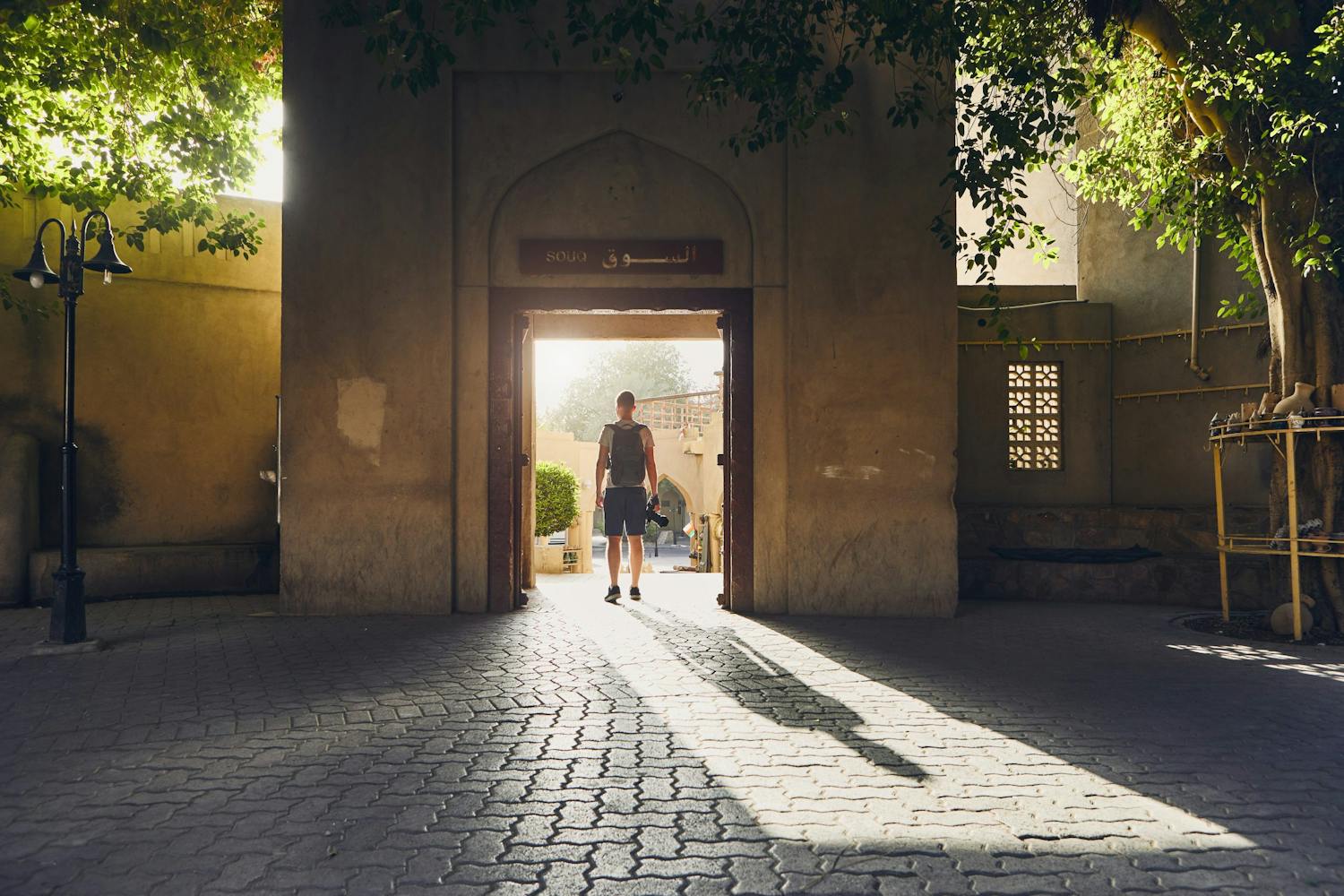 Silhouette,Of,Young,Tourist.,Young,Man,With,Camera,Walking,To
